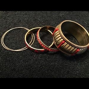 Red and brassy colored bangles.